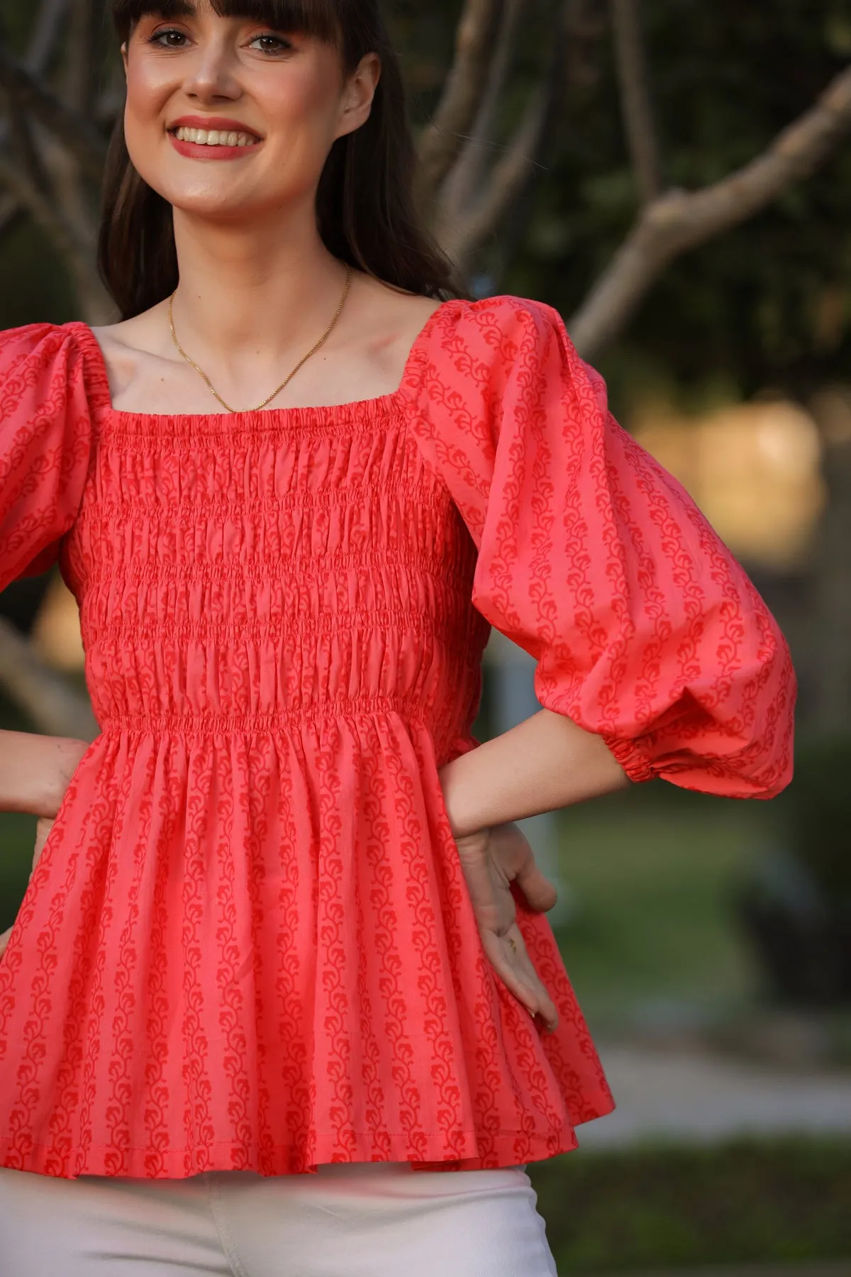 Trails on Smocking Red Top